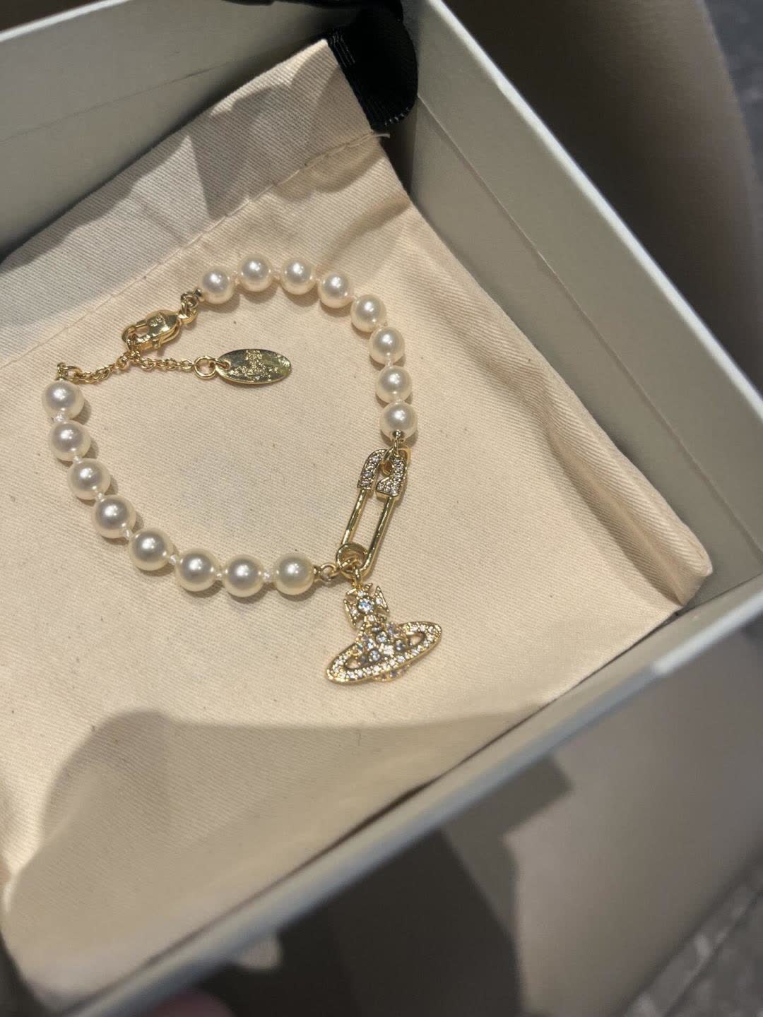 Vivienne Westwood Pearl Bracelet with Orb Charm